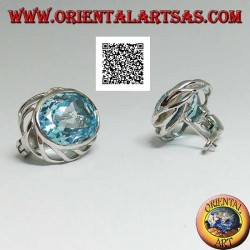 Silver lobe earrings with blue oval topaz on with openwork weave on the sides and lever closure