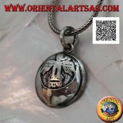 Round silver medal pendant with condor (sacred bird of the Inca civilization) on the moon