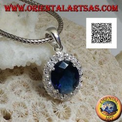 Silver pendant with oval sapphire zircon set surrounded by white zircons