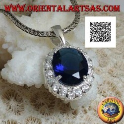 Silver pendant with oval sapphire zircon set surrounded by white zircons