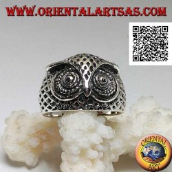 Silver ring in the shape of an owl head with eyes decorated with carvings