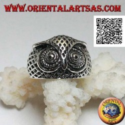 Silver ring in the shape of an owl head with eyes decorated with carvings
