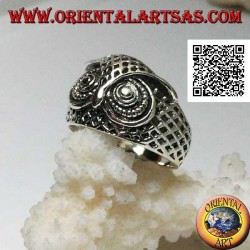 Silver ring in the shape of an owl head with eyes decorated with carvings