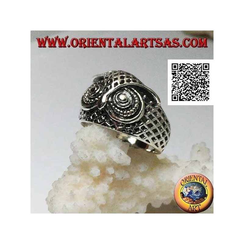 Silver ring in the shape of an owl head with eyes decorated with carvings