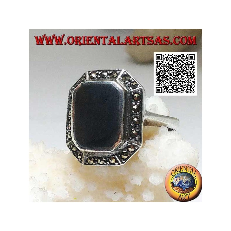 Silver ring with rectangular onyx beveled at the corners surrounded by marcasite