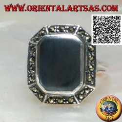 Silver ring with rectangular onyx beveled at the corners surrounded by marcasite