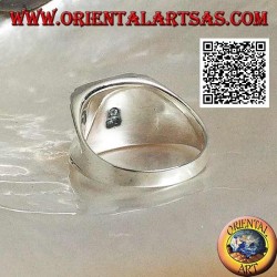Silver ring with rectangular onyx on a smooth frame with central hollow on the sides