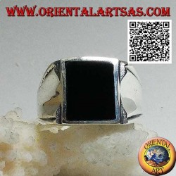 Silver ring with rectangular onyx on a smooth frame with central hollow on the sides