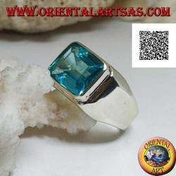 Silver ring with rectangular horizontal blue topaz raised on a smooth frame