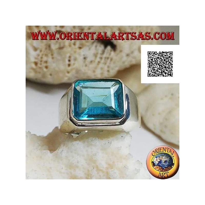 Silver ring with rectangular horizontal blue topaz raised on a smooth frame