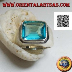 Silver ring with rectangular horizontal blue topaz raised on a smooth frame