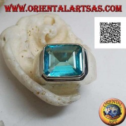 Silver ring with rectangular horizontal blue topaz raised on a smooth frame