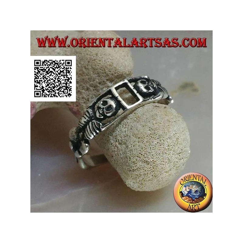 Silver ring composed of two stretched skeletons joined by the arms