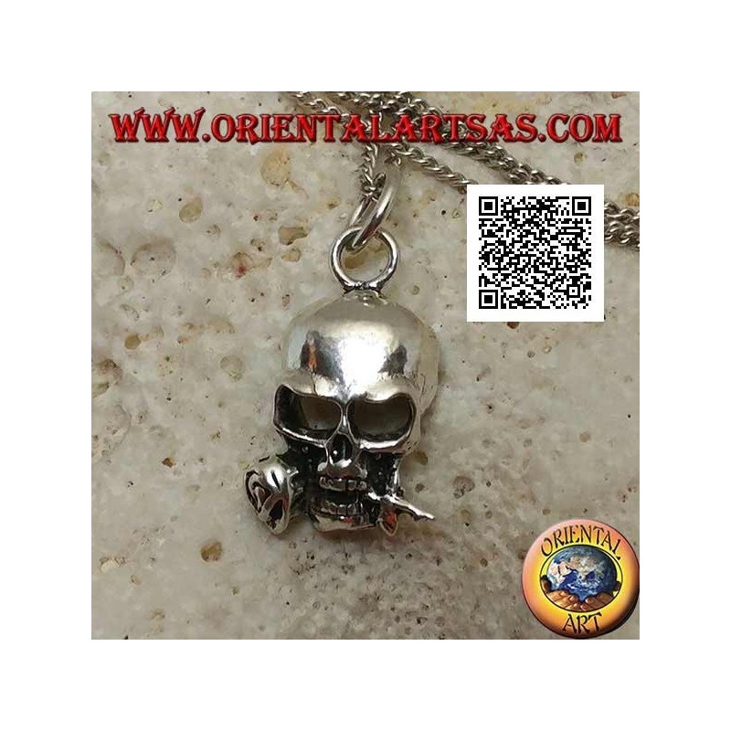 Silver pendant in the shape of a skull with a rose between the teeth
