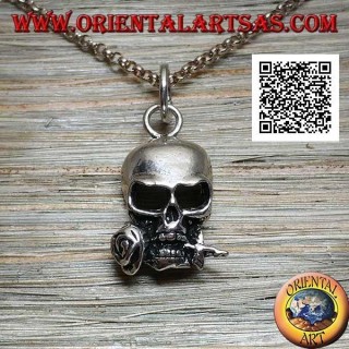 Silver pendant in the shape of a skull with a rose between the teeth