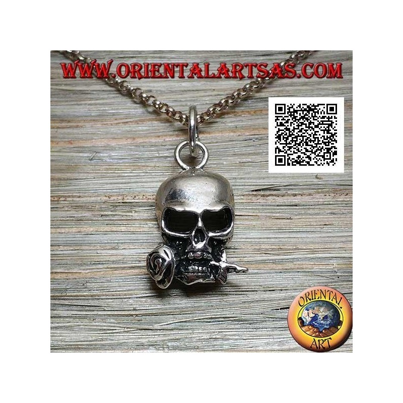 Silver pendant in the shape of a skull with a rose between the teeth