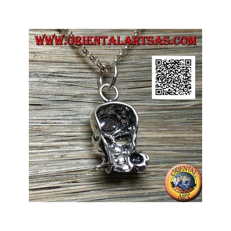 Silver pendant in the shape of a skull with a rose between the teeth