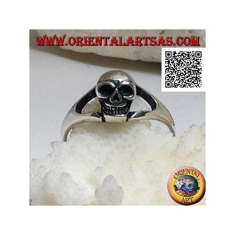 Simple silver ring with small protruding skull