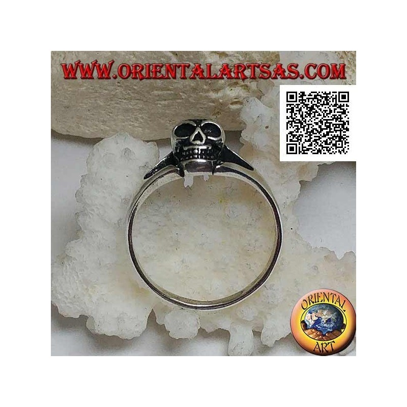 Simple silver ring with small protruding skull