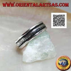 Silver wedding ring with a series of spiral labyrinths engraved in the central part