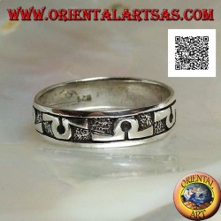 Silver band ring worked with "Omega" symbol in bas-relief