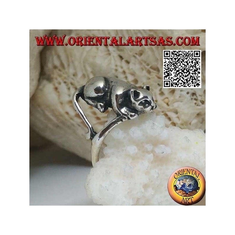 Silver ring with cat lying in an offensive position ready to jump