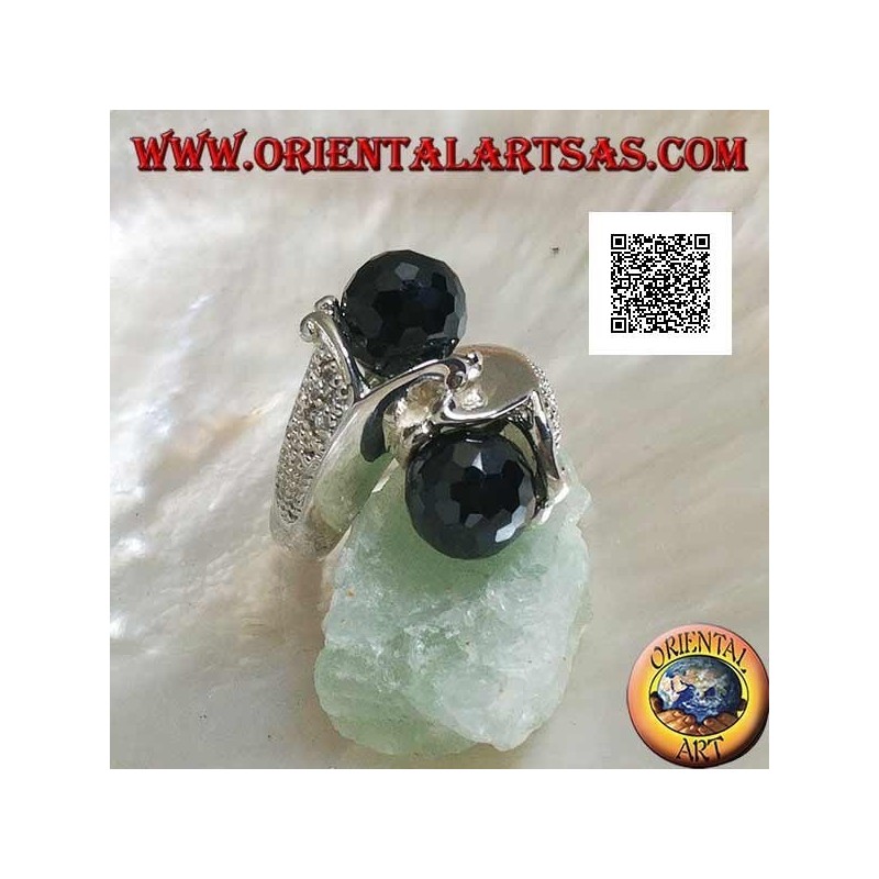 Anillo de plata rodiada de dos brazos con dos esferas facetadas de circonita espinela