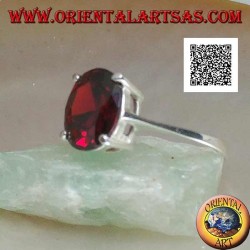 Rhodium silver ring with faceted oval cabochon garnet set with 4 clips