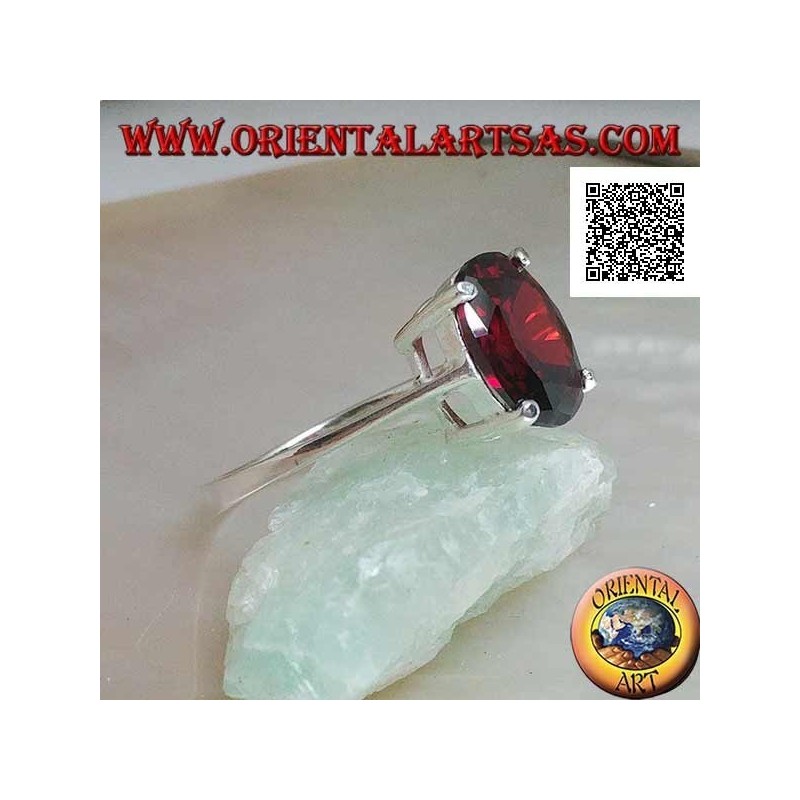 Anillo de plata rodiada con granate cabujón ovalado facetado engastado con 4 clips