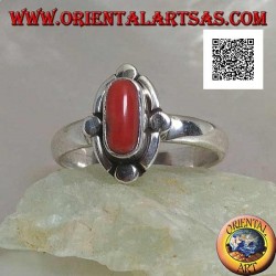 Silver ring with oval natural coral surrounded by alternating bands and discs