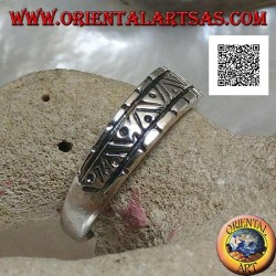 Silver ring with engravings of various geometric shapes