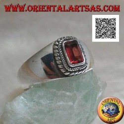 Silver ring with raised rectangular natural garnet surrounded by a double weave