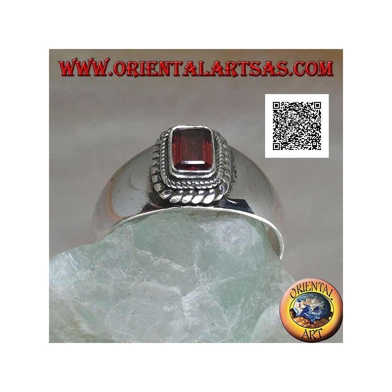 Silver ring with raised rectangular natural garnet surrounded by a double weave