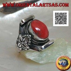 Silver ring with oval antique Tibetan coral in Nepalese setting with leaf on the sides