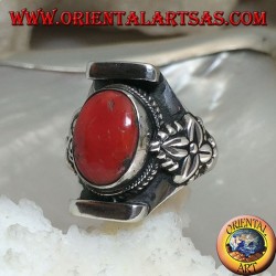 Silver ring with oval antique Tibetan coral in Nepalese setting with leaf on the sides