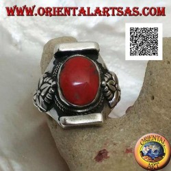 Silver ring with oval antique Tibetan coral in Nepalese setting with leaf on the sides