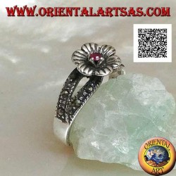 Silver ring in the shape of a flower with round natural garnet set in the center on two rows of marcasite