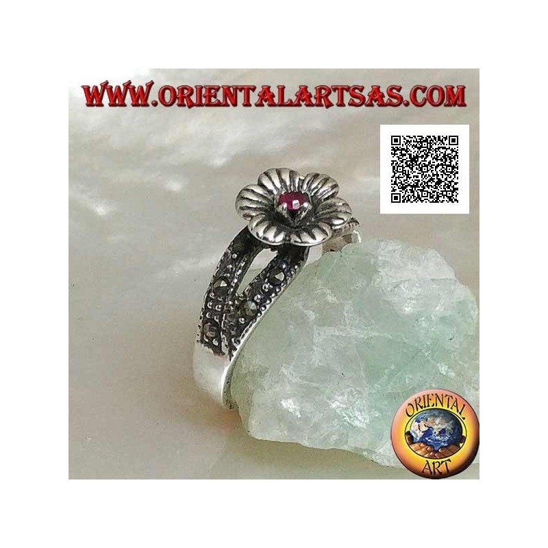 Silver ring in the shape of a flower with round natural garnet set in the center on two rows of marcasite