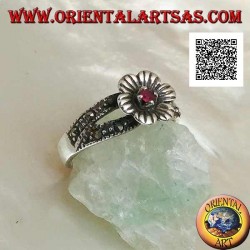 Silver ring in the shape of a flower with round natural garnet set in the center on two rows of marcasite