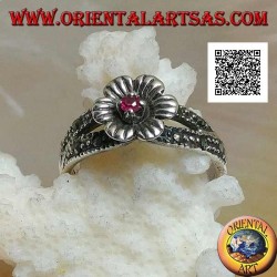 Silver ring in the shape of a flower with round natural garnet set in the center on two rows of marcasite