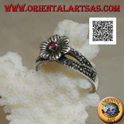 Silver ring in the shape of a flower with round natural garnet set in the center on two rows of marcasite