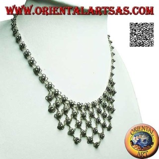 Silver choker necklace of chained flowers with floral decoration on the chest