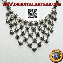 Silver choker necklace of chained flowers with floral decoration on the chest