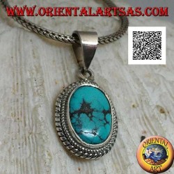 Silver pendant with antique oval Tibetan turquoise surrounded by a small and large double weave