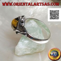 Silver ring with square green amber mounted in a rhombus and two wires on the edges