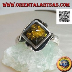 Silver ring with square green amber mounted in a rhombus and two wires on the edges