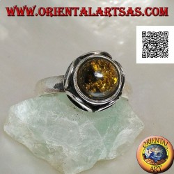 Silver ring with cabochon round green amber surrounded by semicircles in high relief