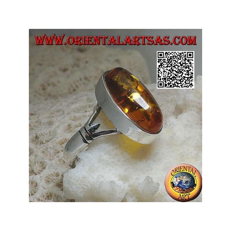 Silver ring with an elongated oval cabochon amber attached to two