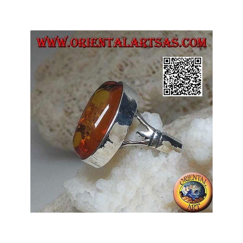 Silver ring with an elongated oval cabochon amber attached to two