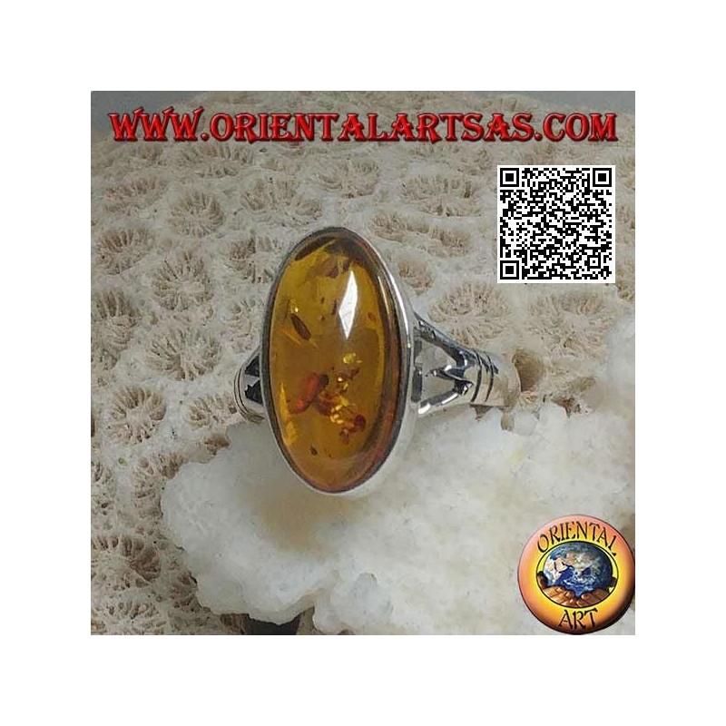 Silver ring with an elongated oval cabochon amber attached to two